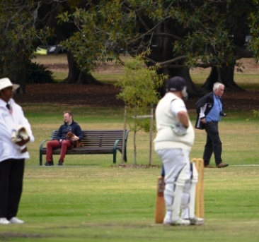 Mark Gauci seems more focused on president Charlie Walker patrolling the boundary with his camera.
