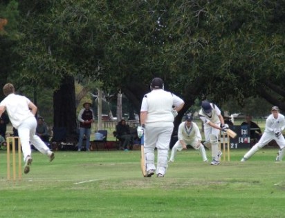 Matt Wenlock clips the ball to leg, watched by Mark Gauci at the non-striker's end.