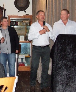 An emotional Dean Jukic speaks about his Life Membership, flanked by Mark Gauci (left) and Darren Nagle.