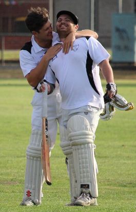 Anthony Riggio (right) celebrates his maiden century with good mate Chris Pollock, who came across with him from Aberfeldie Park.