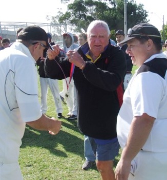 Leadership all round: Past captain Brett Curran gets his premiership medallion from Ralph Barron, as current skipper Mark Gauci looks on.