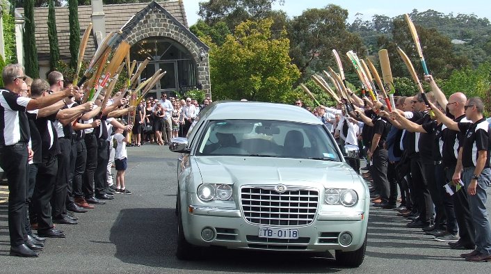 Moonee Valley players and other friends of Heath Webb-Johnson send him off with a guard of honor.