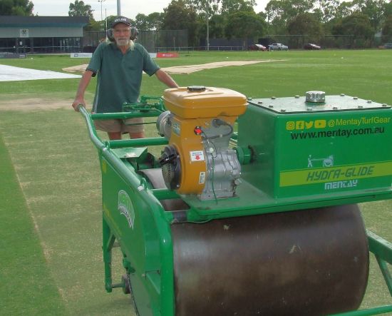 Our long-standing curator Ian "Spider" Beel rolls the Ormond Park pitch for his last Grand Final.