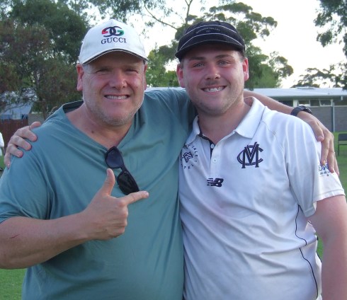 Grand Final player of the match Lachlan Smith (far right) is congratulated by his father Geoff, a 100-game Valley player himself.