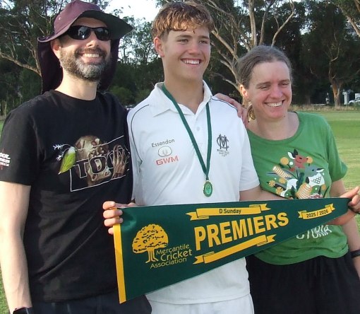 Happy family: David Lubansky with parents Alex and Rebecca and the Premiership pennant.