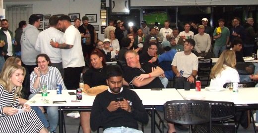 A view of the gathering watching the raffle draw.